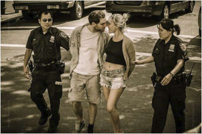 True Romance: Photo of couple kissing as they ars led away by police. Mo Gelbers “Last Kiss” could be the basis for a film. Mo Gelbers an amateur photographer is a finalist in the Project Imagination” contest sponsored by film maker Ron Howard. 