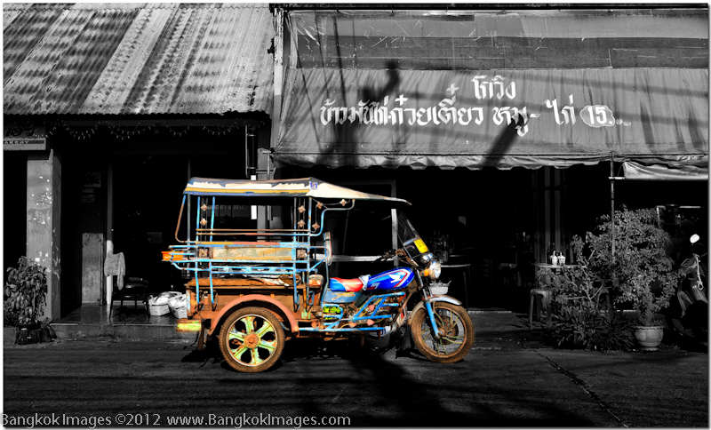 In parts of Thailand you’ll find brightly painted colorful older tuk tuks. It’s almost instinctive to make this capture. A lone vintage tuk tuk, resplendent in it’s design and bright colors juxtaposed over a rather drab background. This processing called for selective saturation techniques we covered in this tutorial Selective Saturation.