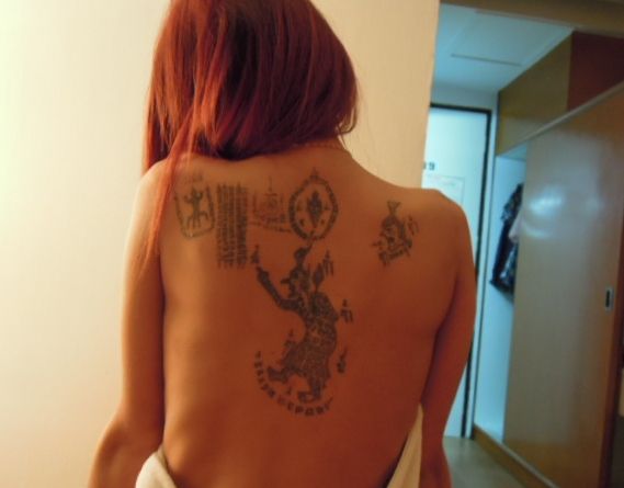 Thai girl back tattoo