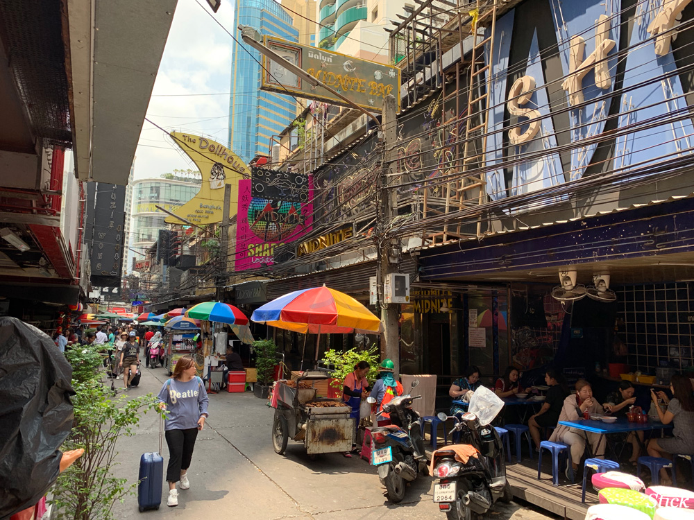 Soi Cowboy by day was full of office girls eating lunch at makeshift tables set up in bar frontages. 