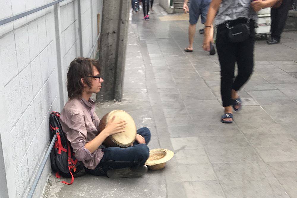 This guy has been hitting this drum for the past few days at On Nut BTS station. 