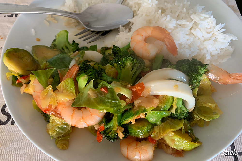 Stir-fried brocolli and Brussel sprouts with shrimp, squid and lots of chilli. 