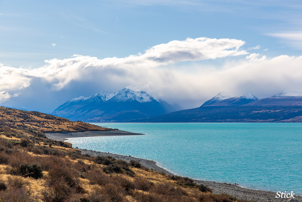Lake Pukaki is a beautiful shade of blue and no, this is not Stick getting silly in Photoshop.. 