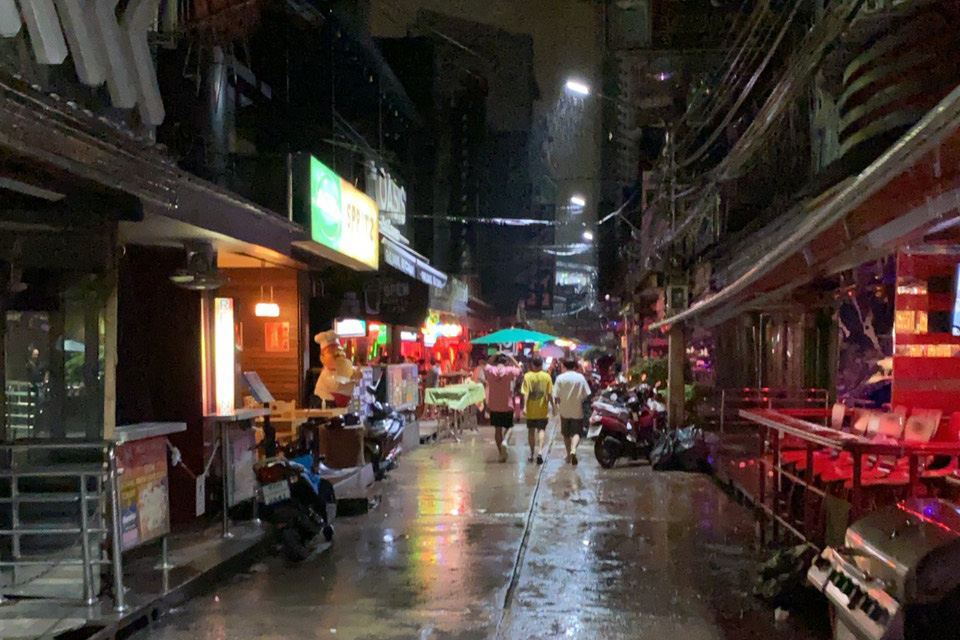 Soi Cowboy, late last night. Heavy rain and street protests on top of Covid-19 travel restrictions have killed bar trade. 